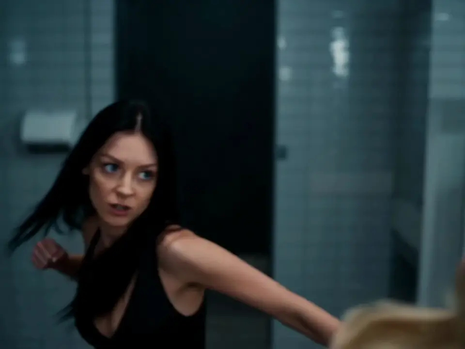 Cinematic AI-generated video of a dynamic fight scene between two women in a restroom, generated with AI video generation on NovaImage AI